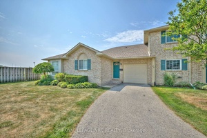 Beautifully Updated Bungalow End Unit Townhome in Prestigious Mount Carmel Estates !