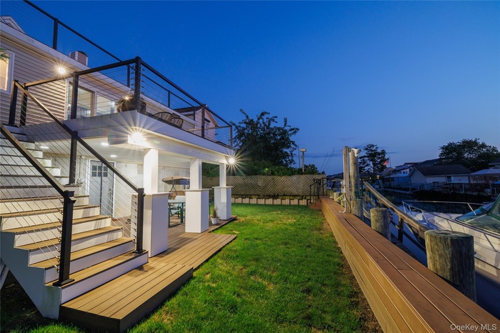 Canal-Front Yard at Twilight, Featuring two decks and a new bulkhead