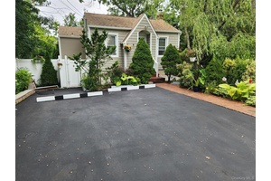 Charming Home Near Long Island Sound Discover your perfect coastal getaway with this beautifully updated home, nestled in a serene and private setting just minutes from the Long Island Sound.
