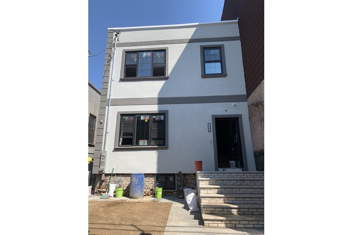 View of front of property featuring stucco siding