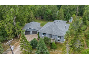 Tucked away on a private, treed 200 by 125 foot lot, this beautiful updated home offers the perfect blend of comfort, functionality and location just steps from sandy beach and ...