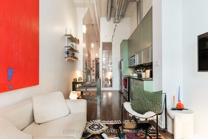 Your dream loft life awaits, a stunning and stylish true hard loft with 16ft ceilings, parking, locker, a private patio entrance, and excellent building amenities just steps from the subway.