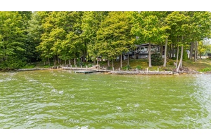 Where the shoreline stretches wide and the seasons play out at your front door, this Lake Eugenia property delivers space, privacy, and four season fun.