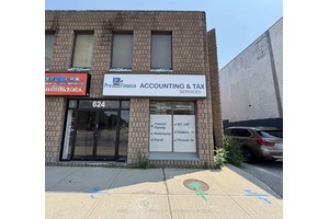 Renovated Multi Use Unit Currently Built Out With A Large Open Retail Space Plus Back Office or Storage Room.