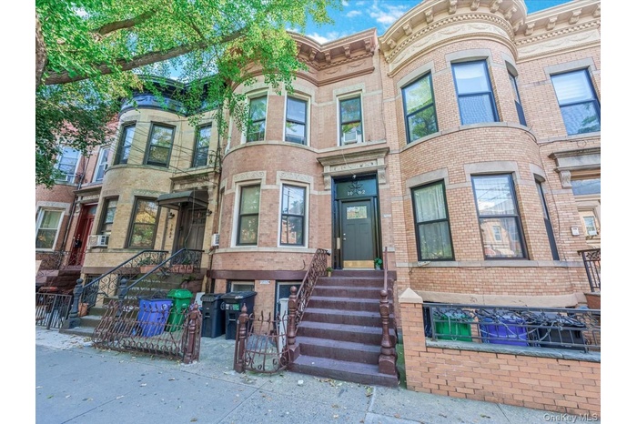 Victorian home with brick siding