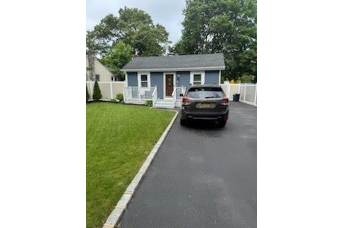 View of front of home with asphalt driveway