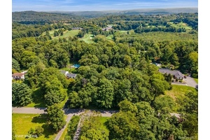 BUILD YOUR CUSTOM HOME ON THIS UNIQUE LOT IN THIS WELL SOUGHT AFTER COMMUNITY !