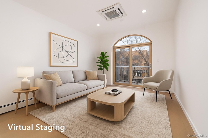 Living area featuring recessed lighting, cooling unit, and light wood finished floors