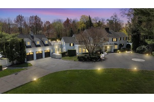 At the end of a long private driveway the exceedingly charming Georgian Colonial aptly styled Twin Pines awaits.