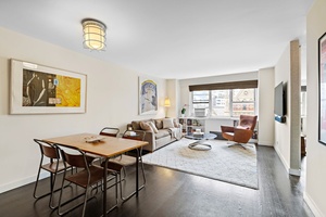 This beautifully renovated two bedroom, one bath corner home, offers breathtaking western views of the Jefferson Market Library.