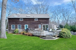 Embrace refined living in this charming residence nestled in the heart of Southold.