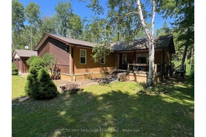 Beautifully updated and spacious 3 bedroom bungalow on serene and very private 1.