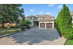 This stucco front exquisite residence is masterfully built with high quality materials and fine craftsmanship.
