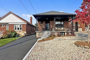 A beautiful renovated detached bungalow with private driveway.