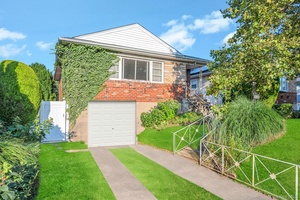 Welcome to 159 15 89th Street, a beautifully maintained 3 bedroom, 2 bathroom raised ranch situated on a quiet, tree lined block in the heart of Howard Beach.