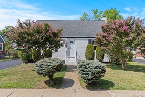Spacious renovated cape home in prime location offers style, comfort and convenience.