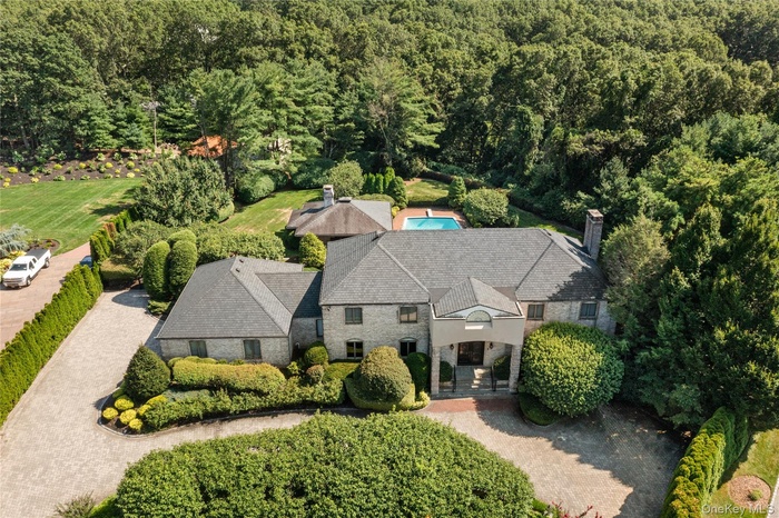 View from above of property with a heavily wooded area