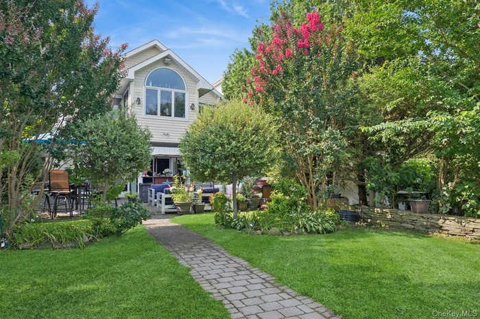 View of community featuring a lawn