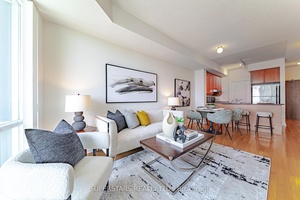 Freshly painted and well maintained 1 Den, 2 bath unit with 730 sqft of open concept living space and soaring 9 ceilings.