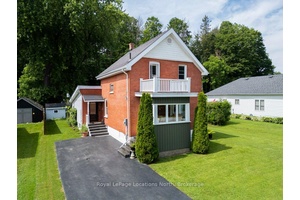 Welcome to 25 Edwin Street, a beautifully maintained century home full of character and charm, nestled on a quiet street in the heart of Meaford, backing onto nature.