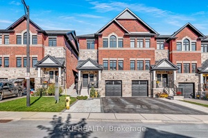 This stunning end unit townhome truly has it all !