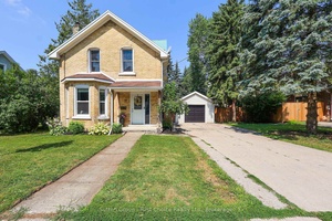 This adorable two bedroom, two bathroom home sits on a large lot with an insulated detached garage located walking distance from schools, local brewery, parks, a rink and downtown Stratford.