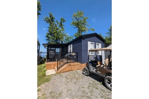Enjoy spectacular lakefront living in this beautiful 3 bedroom, 1 bath Waverly Resort Cottage model.