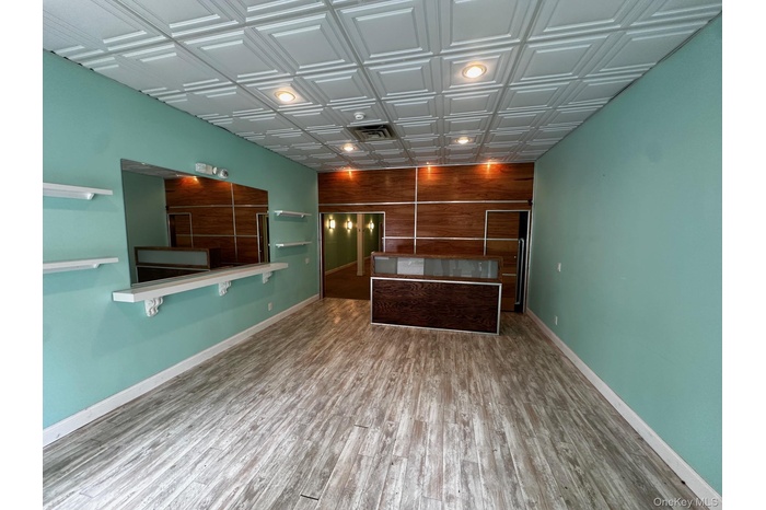 Welcome area featuring an ornate ceiling and wood walls