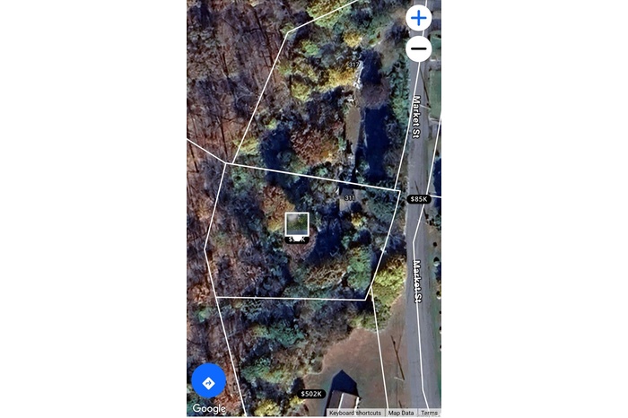 Aerial map of property and surrounding area with property boundaries highlighted