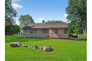 Nestled on a tranquil tree lined street, this delightful 3 bedroom ranch home offers an exceptional opportunity for comfortable living amidst nature's beauty.