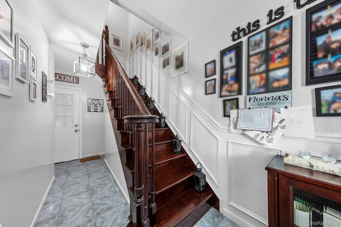 Stairway featuring baseboards