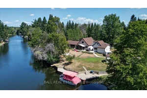 Burnt River home or cottage on a large lot, with a three bedroom secondary residence and a large shop.