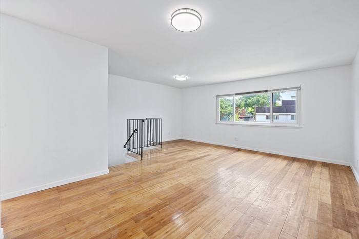 Unfurnished room featuring light wood-style floors and baseboards