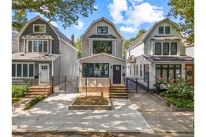 A meticulously renovated single family house nestled on a quiet tree lined street of forest hills.