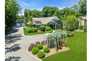 Welcome to a unique compound, this stunning Craftsman home showcases an airy open concept layout with soaring ceilings and elegant rift and quartered oak flooring thoughout, known for its beauty ...