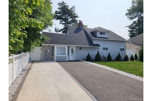 Move Right into This Recently Renovated Expanded Home with Huge Living Room, Formal Dining Room W FP, Newly Renovated EIK, 4 Bedrooms, 2 Full Baths, Laundry on 2nd Floor.