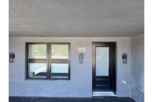 A MUST SEE ! This Meticulously Renovated Main Floor Unit, Nestled Within A Serene Low Rise Building Comprising Just Two Exclusive Residences.