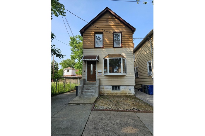 View of front of home featuring entry steps and cooling unit