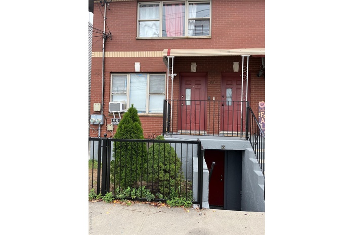 Property entrance with brick siding