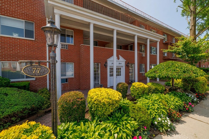 Entrance to property with brick siding