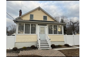 Welcome to this charming Cape Cod style residence, fully renovated to offer the perfect blend of classic charm and modern comfort.
