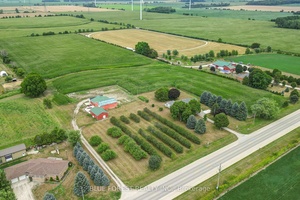 Situated on 21. 5 acres, this property features a large shop with bay door, car hoist, and loft, plus a second building with a 3 piece bath, perfect for hobbies, ...
