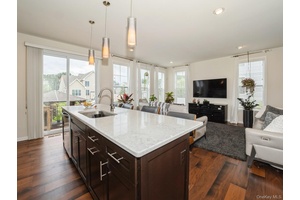 Designer inspired townhome with top quality finishes in highly sought after Hopewell Glen !