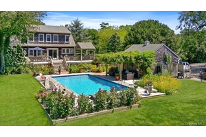 This Charming Cape is situated on a beautifully landscaped shy acre in Brookhaven Hamlet.