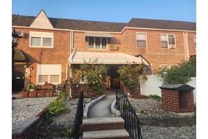 Welcome to this charming single family brick townhouse in Middle Village with 1 car garage, located only 1 block to Juniper Park.