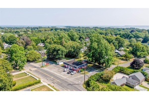Prime. 21 acre corner location at the intersection of Main Road and Oyster Ponds Lane, just steps from the charm and amenities of Historic Orient Village.