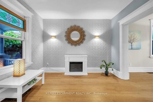 Discover this stunning red brick 2 1 2 story century home with covered porch, on a picturesque tree lined street in the highly sought after Strathcona neighbourhood.