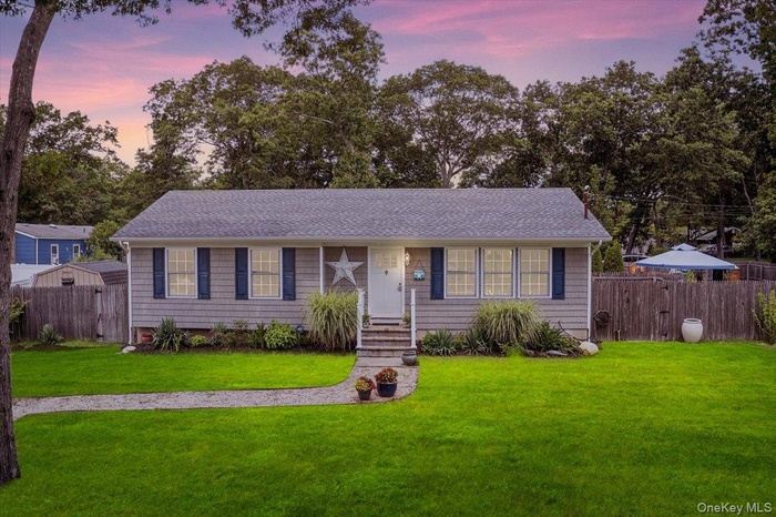 View of front of home featuring roof with shingles
