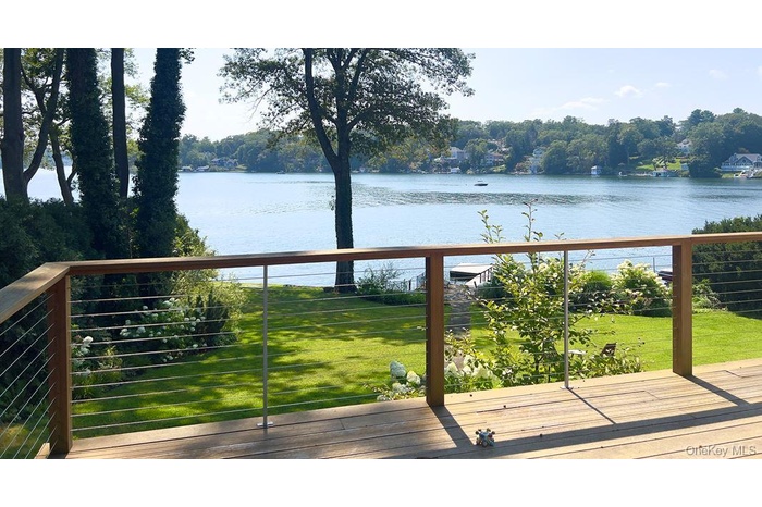 Huge Mahogany entertainment deck with water views