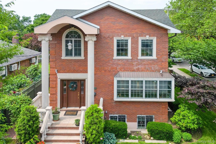 View of front of house featuring brick siding